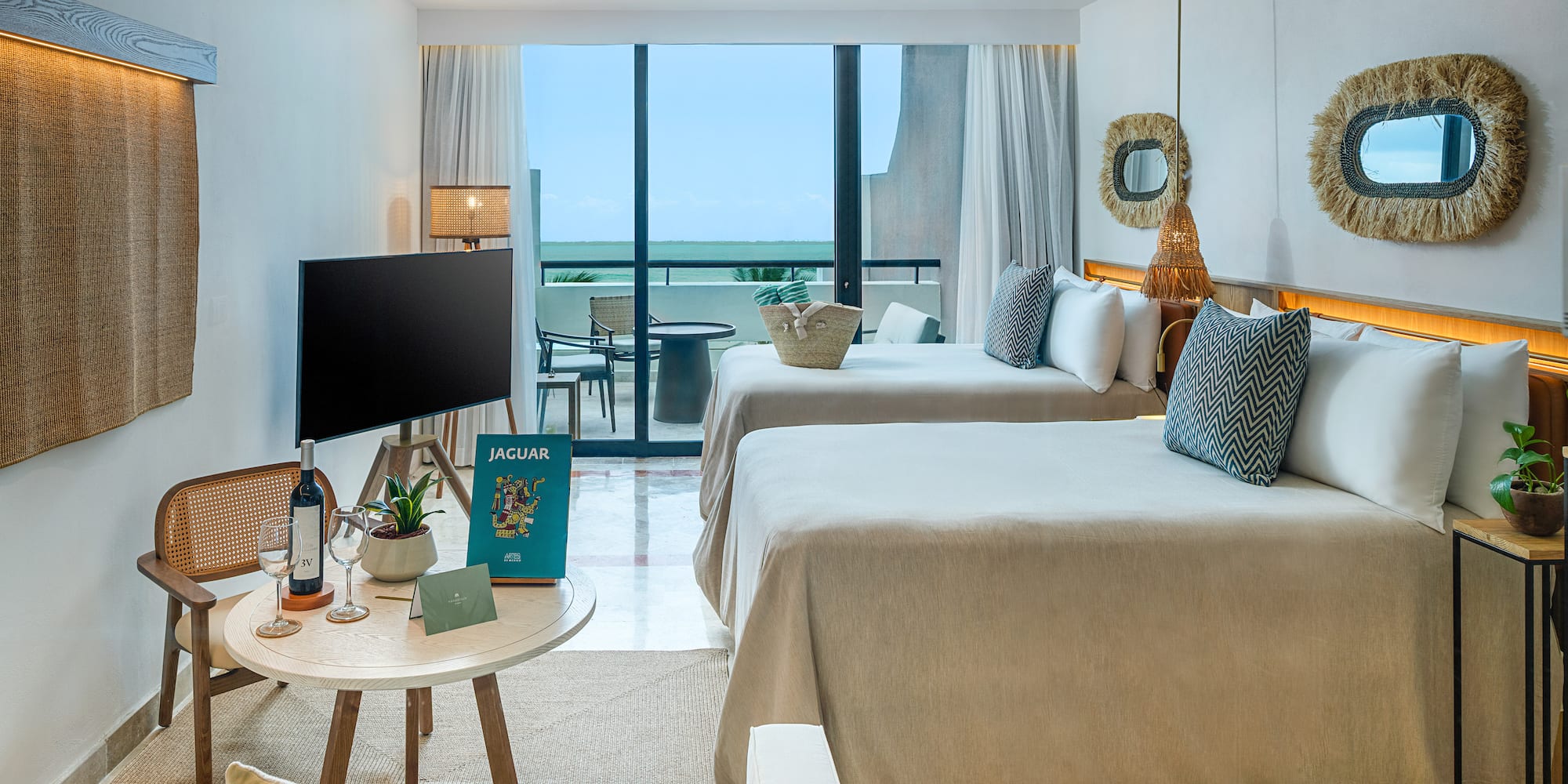 a room with two beds and a television