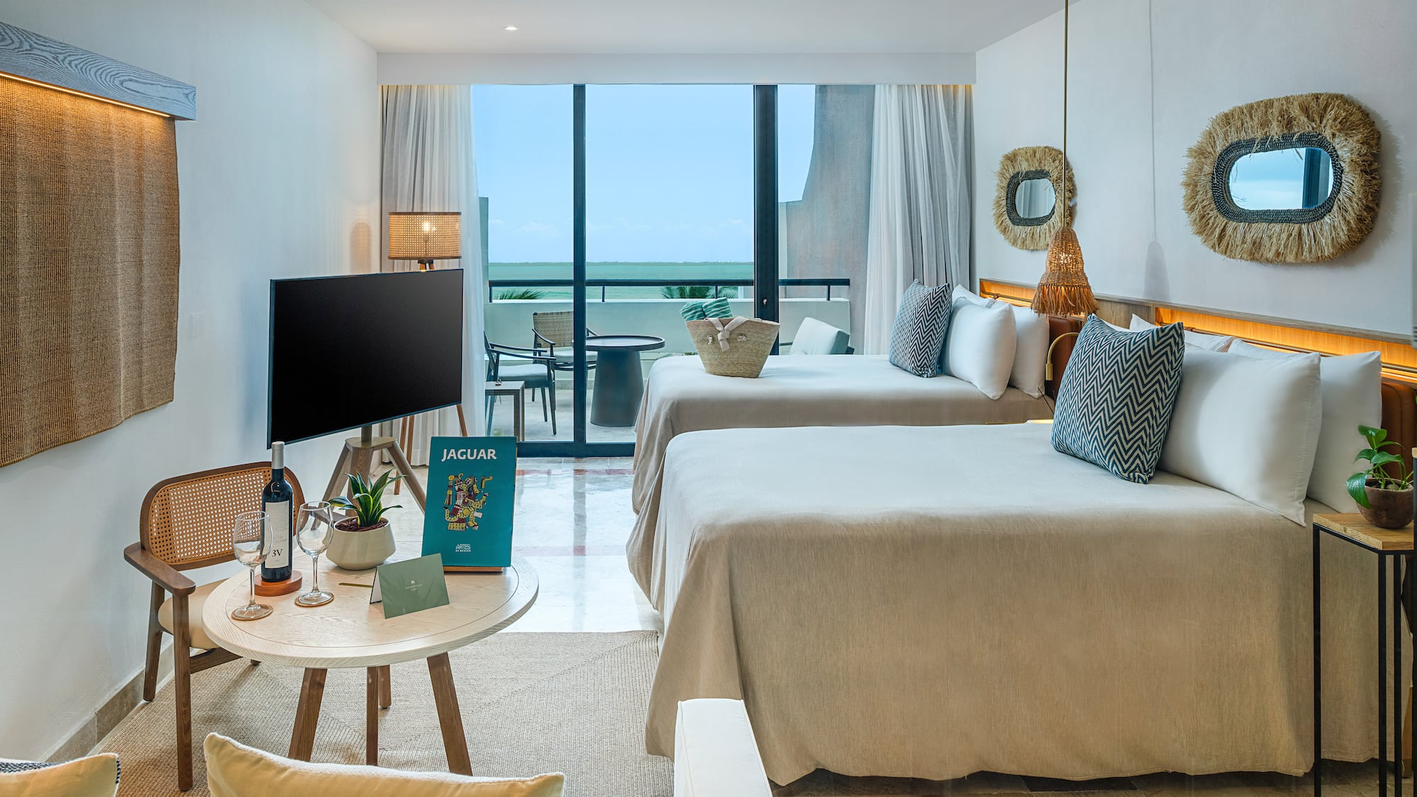 a room with two beds and a television