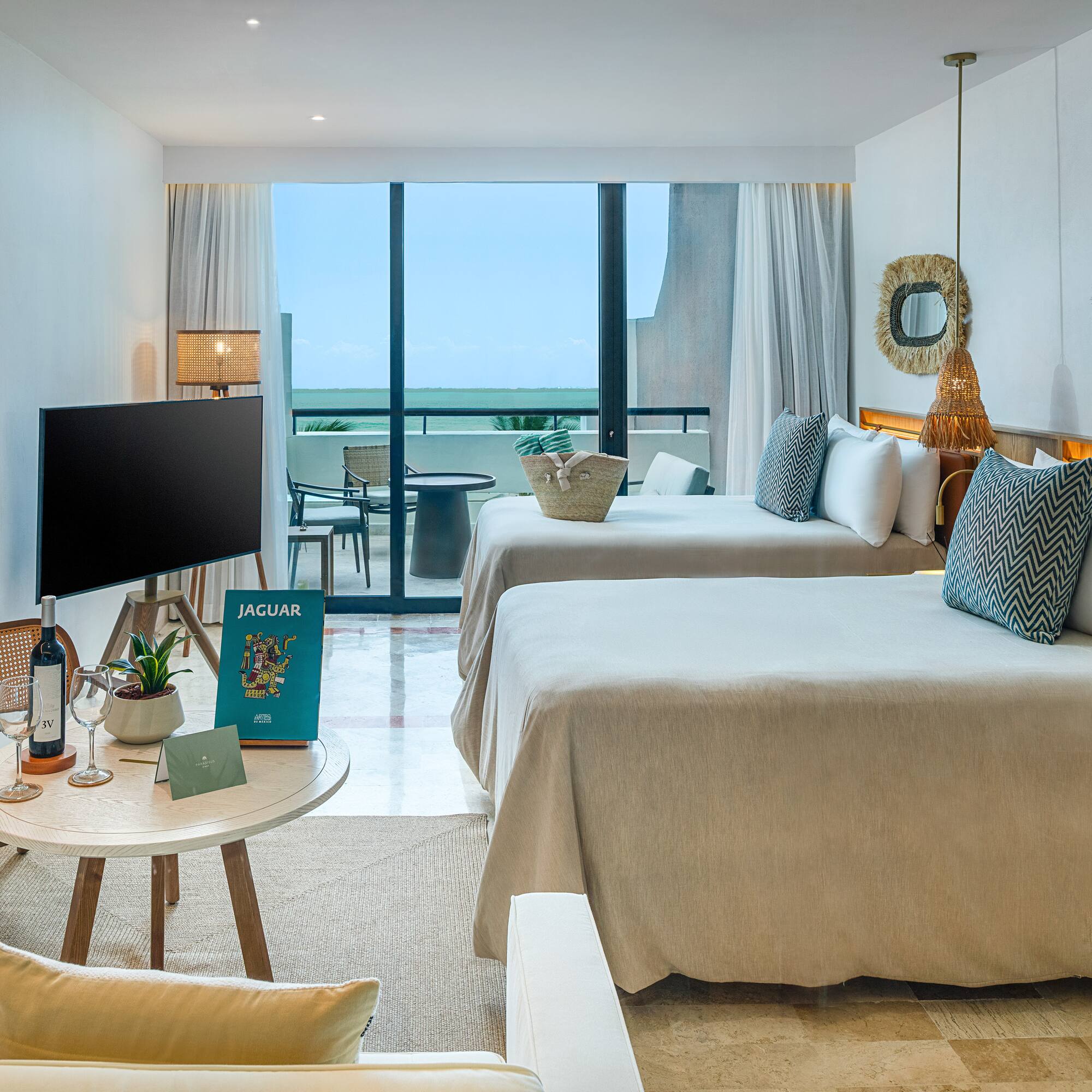 a room with two beds and a television