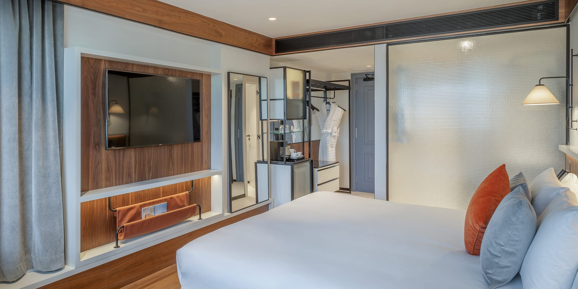 a room with a bed and a tv