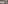 a room with tables and chairs and a view of the ocean