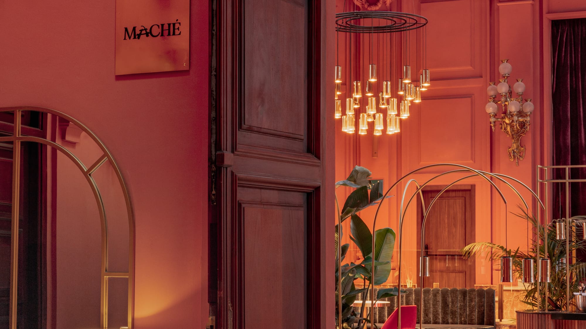 a room with a pink wall and a large doorway