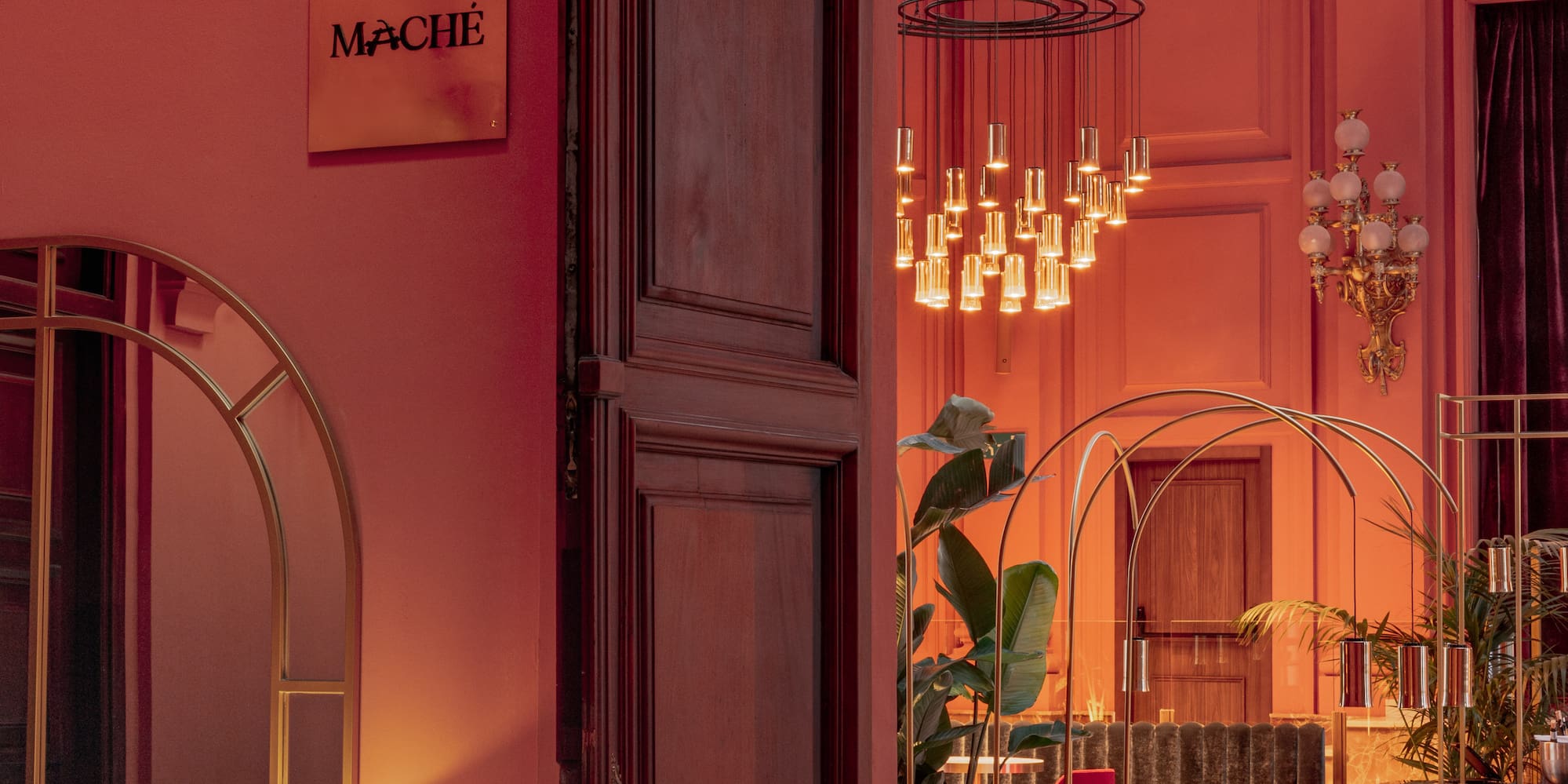 a room with a pink wall and a large doorway
