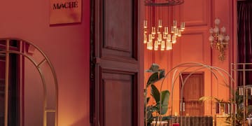 a room with a pink wall and a large doorway