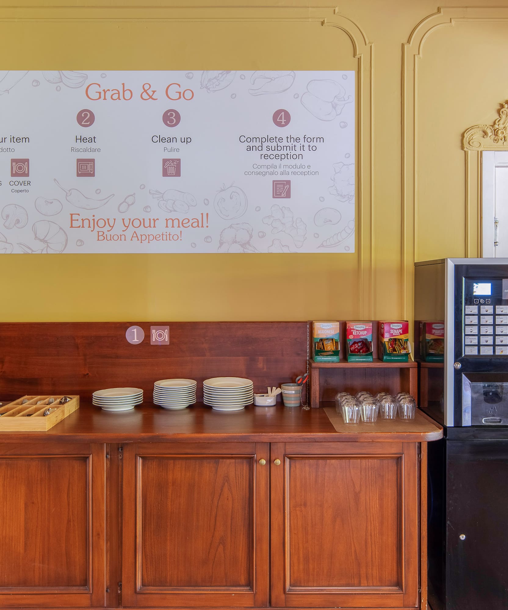 Grab & Go self-service food station with vending machine, plates, and condiments.