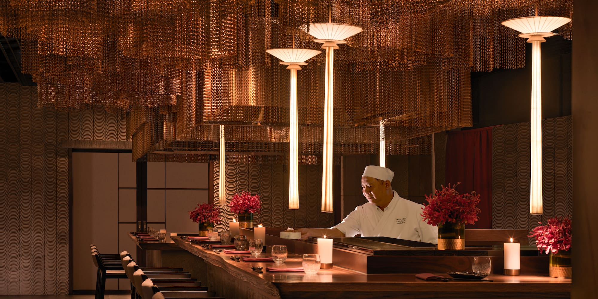 a chef working at a bar