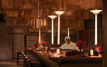 a chef working at a bar