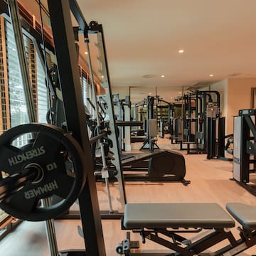 a gym with weights and exercise equipment
