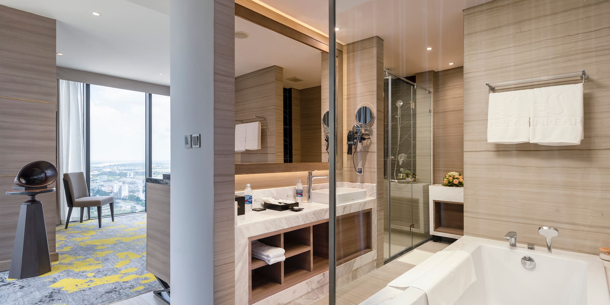 a bathroom with a glass shower and tub