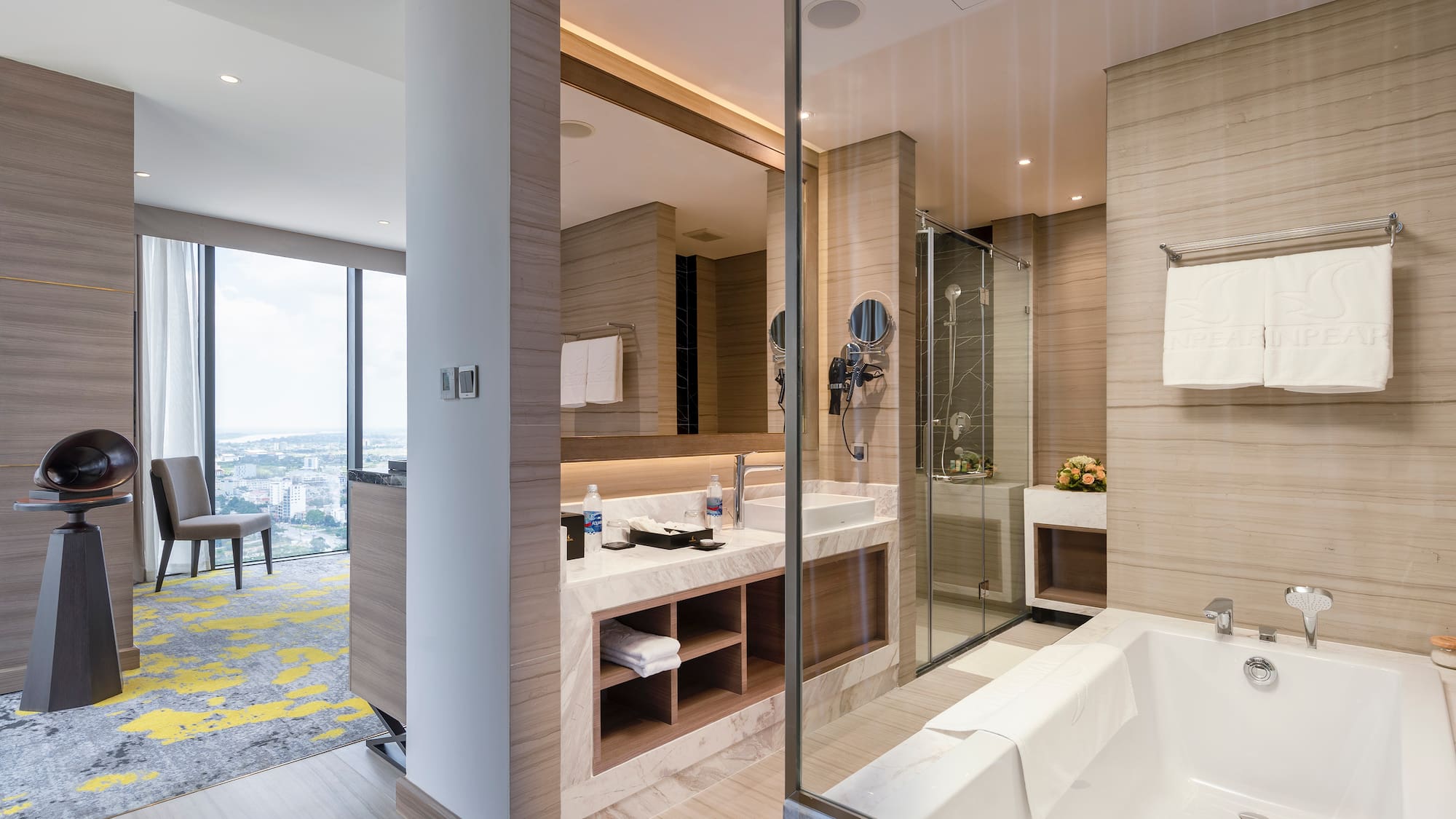 a bathroom with a glass shower and tub
