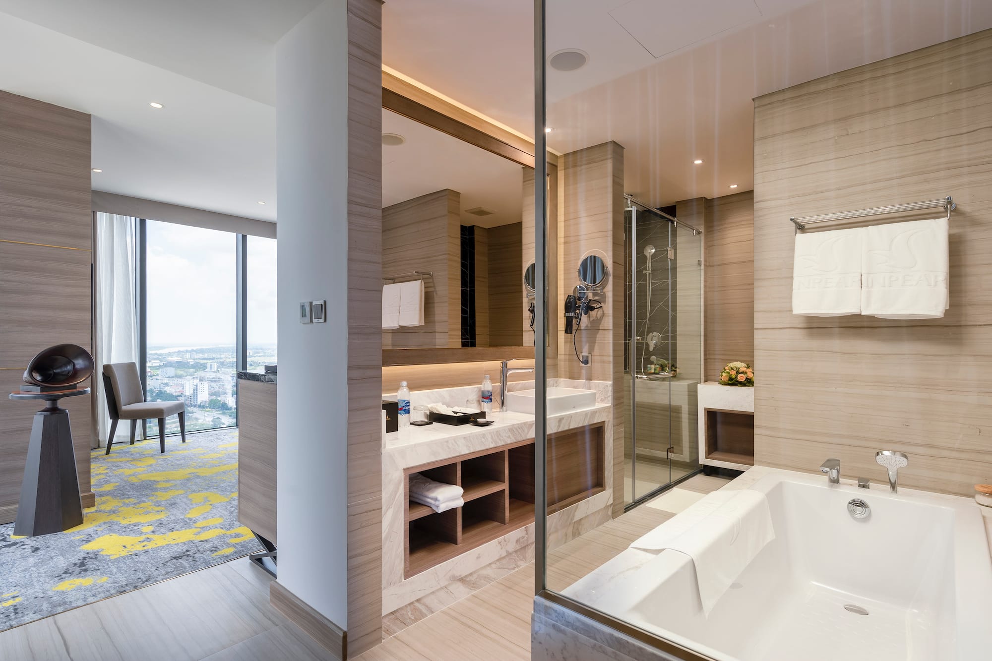 a bathroom with a glass shower and tub