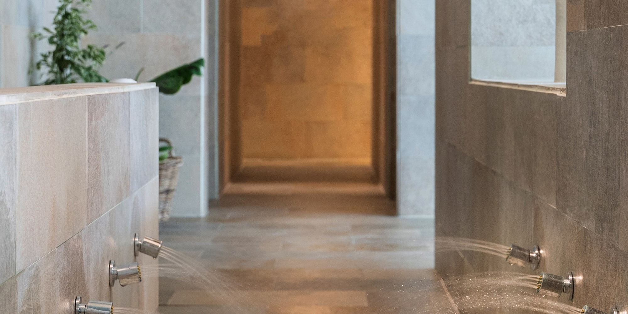 a shower with water running out of the walls