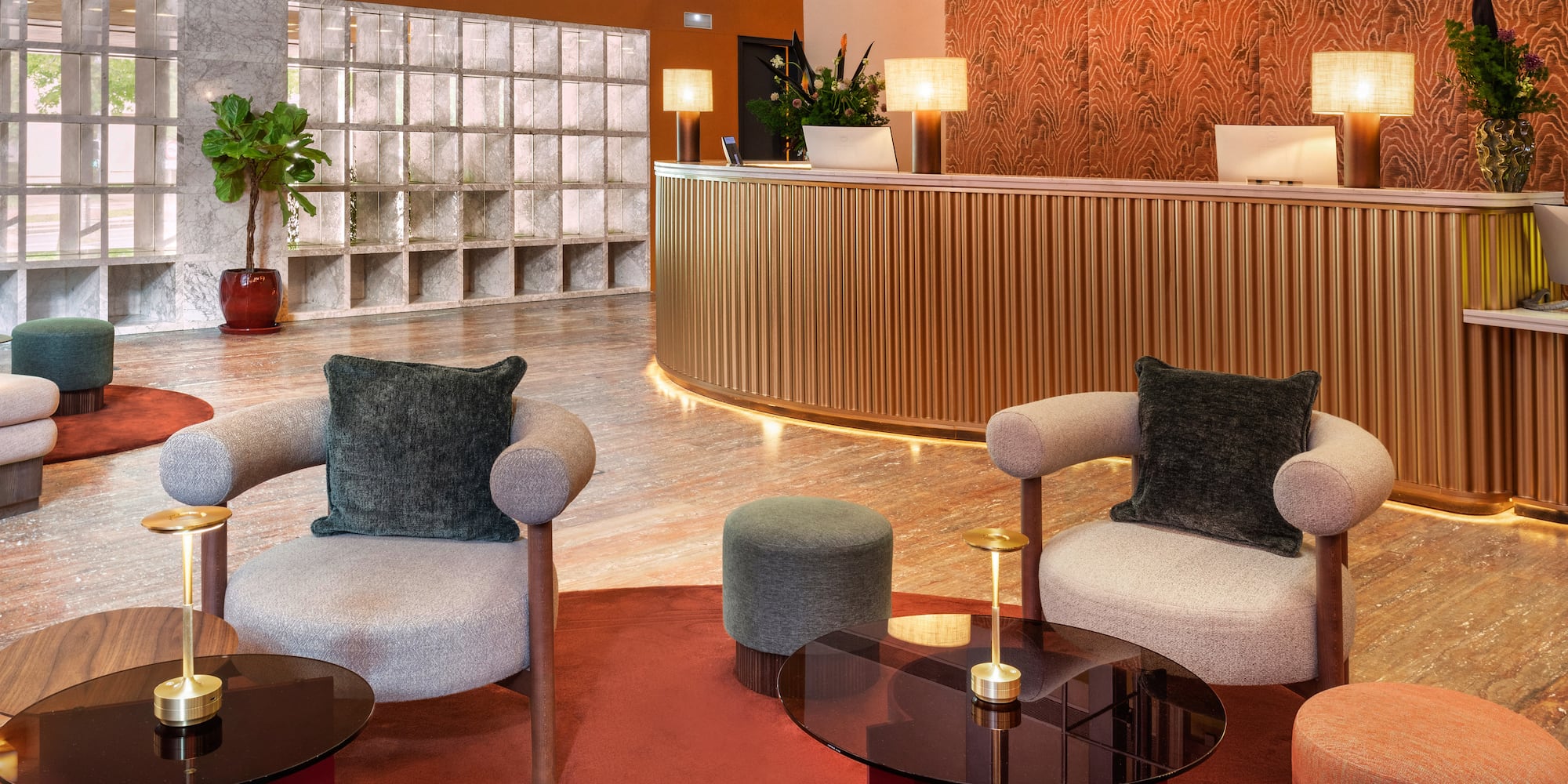 a lobby with a reception desk and chairs