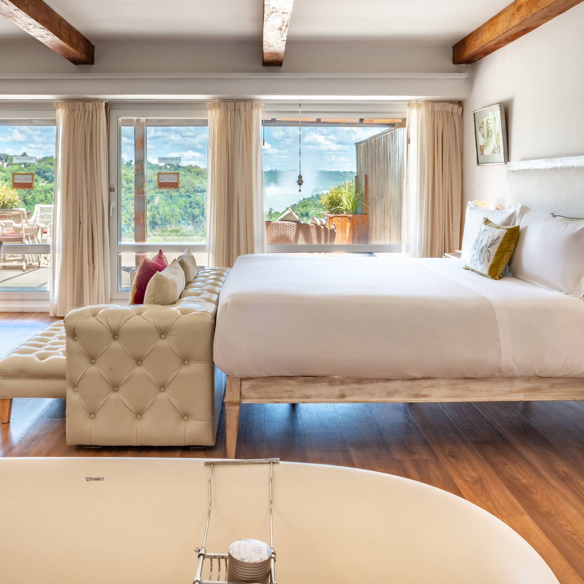 a room with a bed and a bathtub