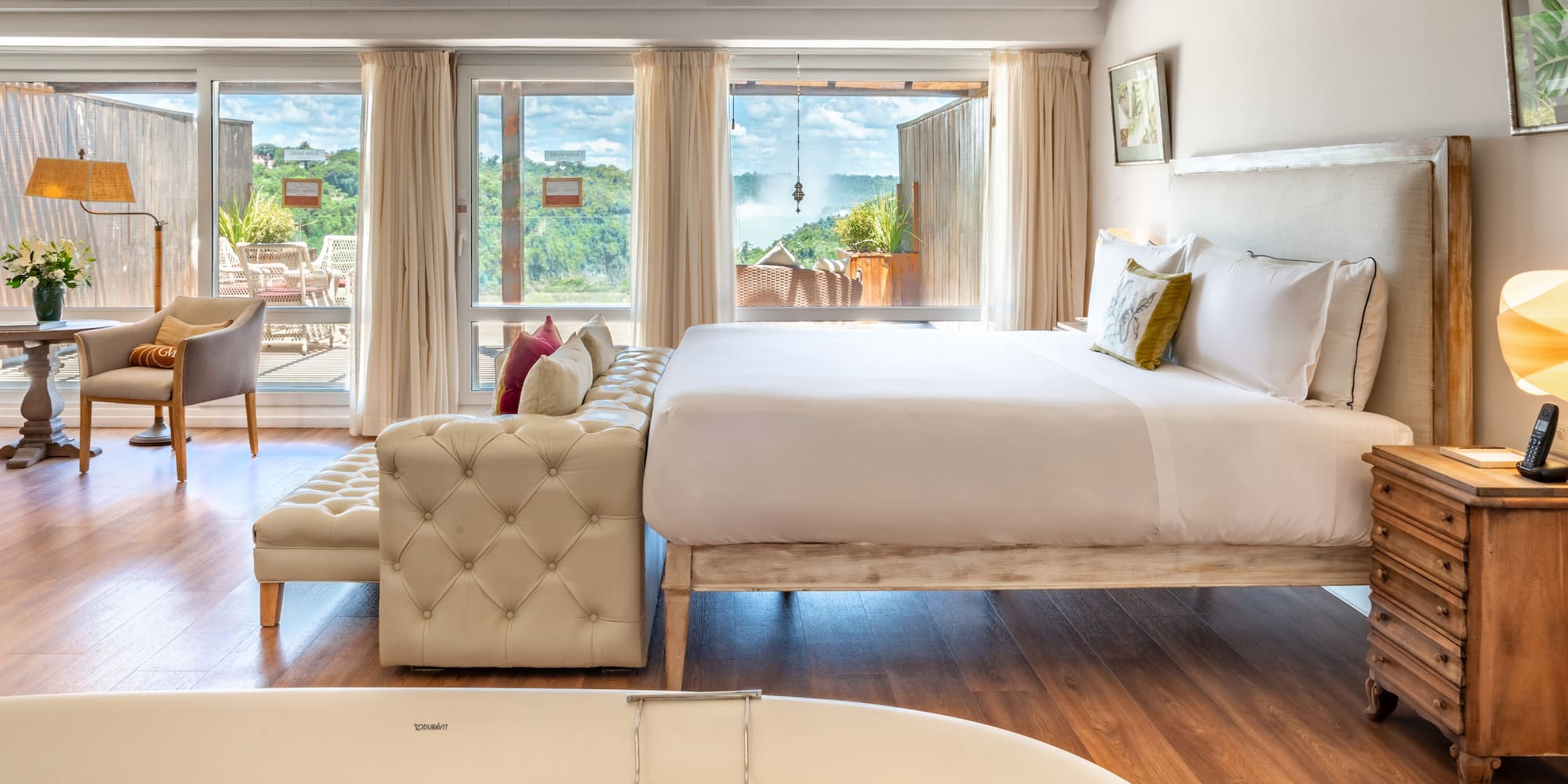 a room with a bed and a bathtub