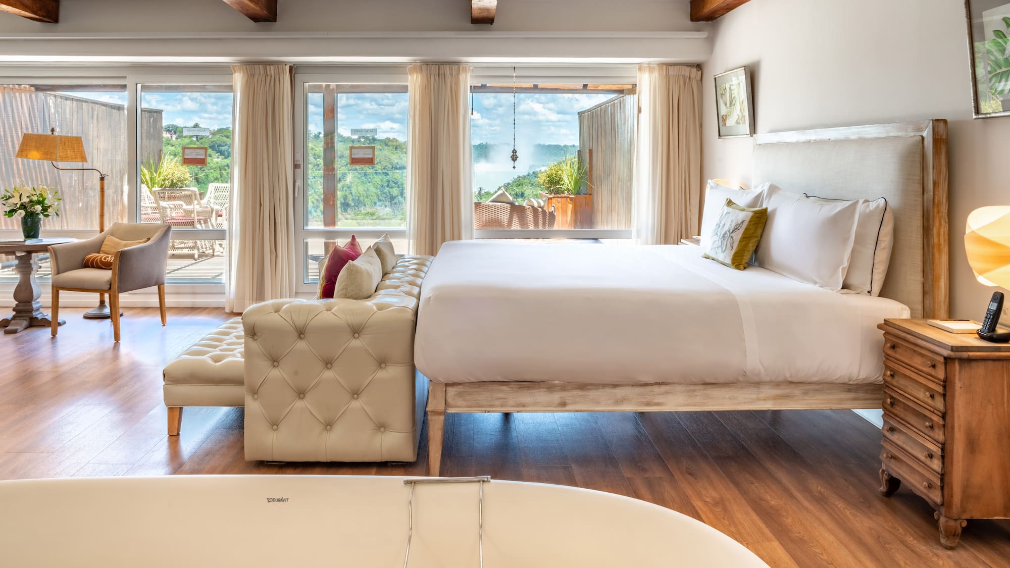 a room with a bed and a bathtub