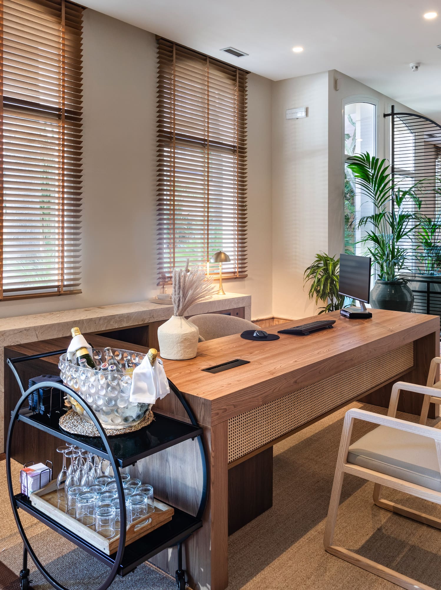 a room with a desk and chairs