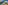 Aerial view: Large coastal resort, sandy beaches, long jetty, and channel.