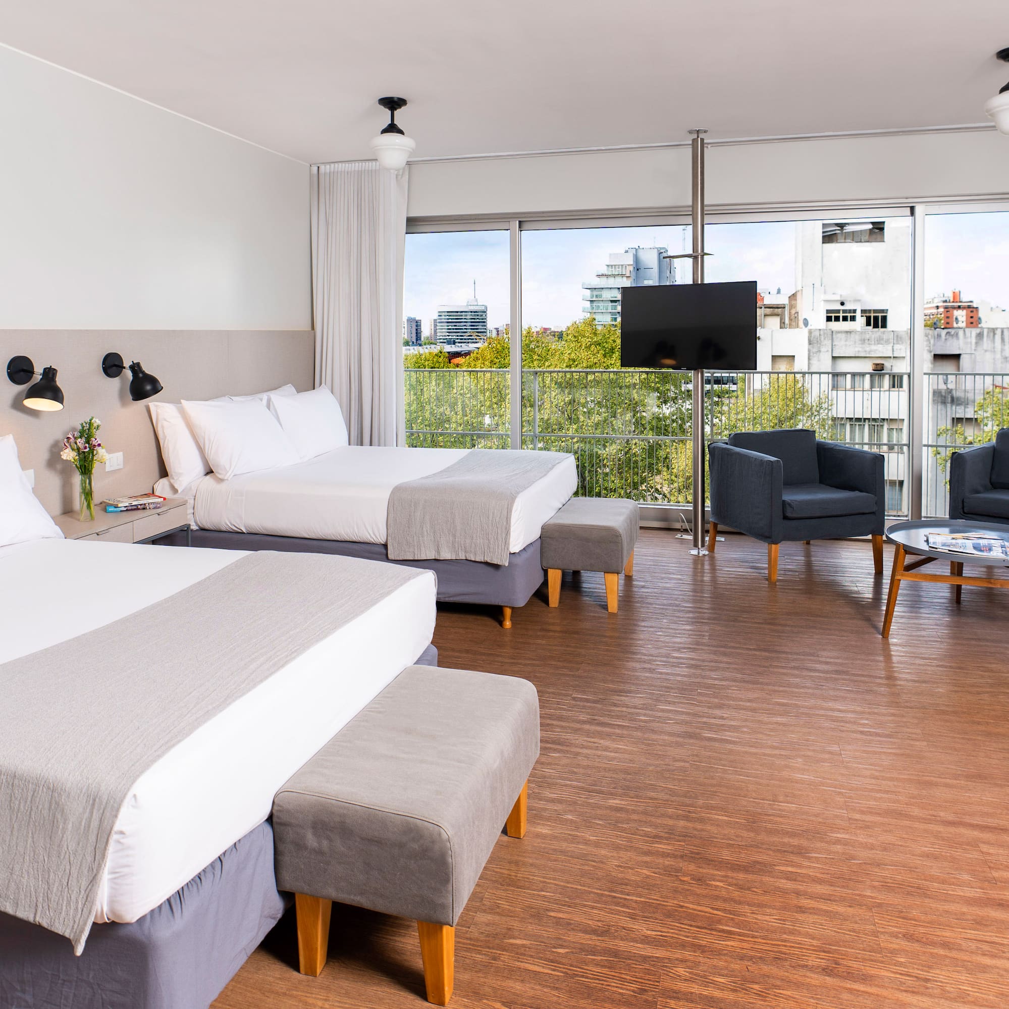 a room with two beds and a couch