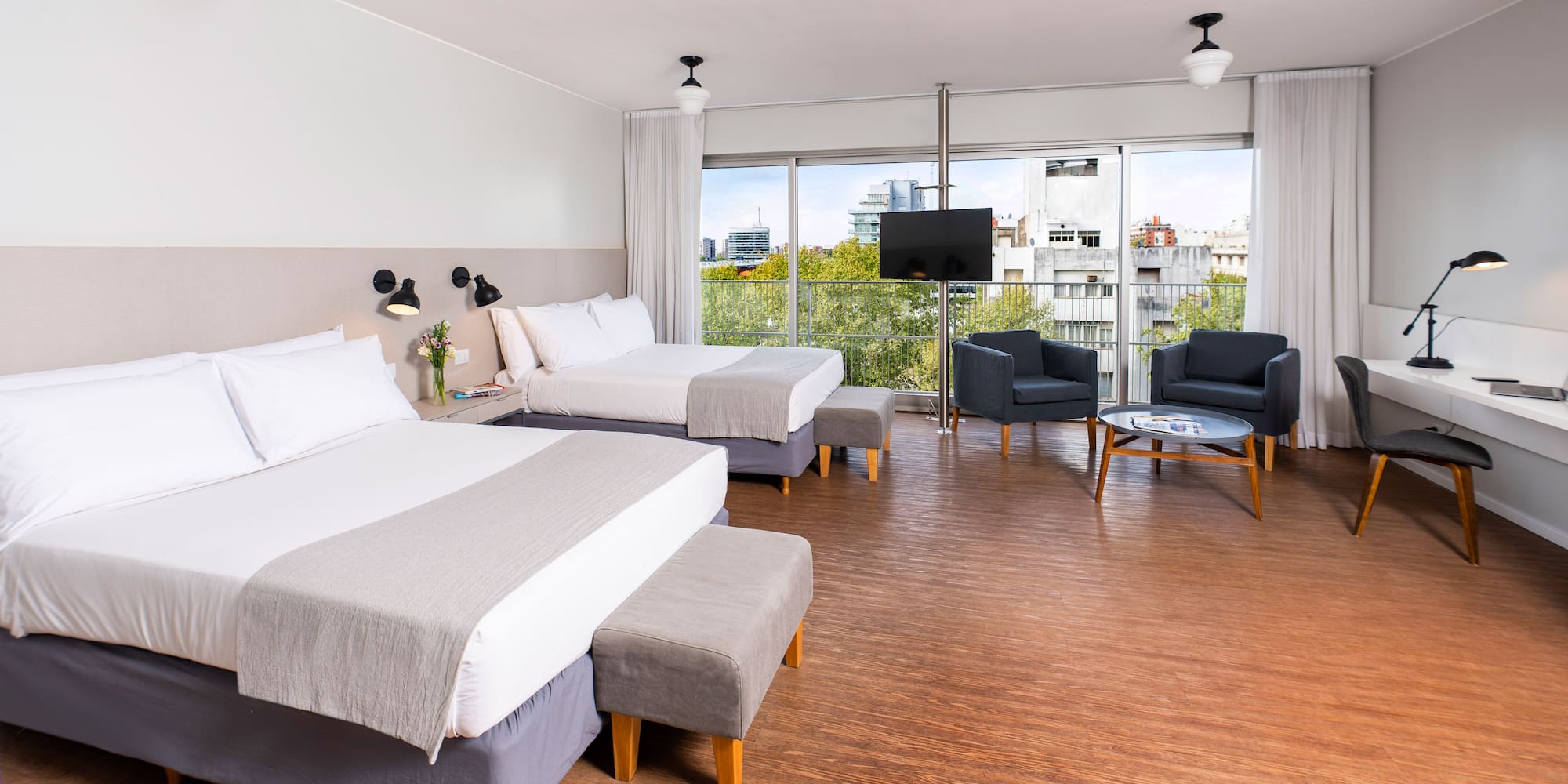 a room with two beds and a couch