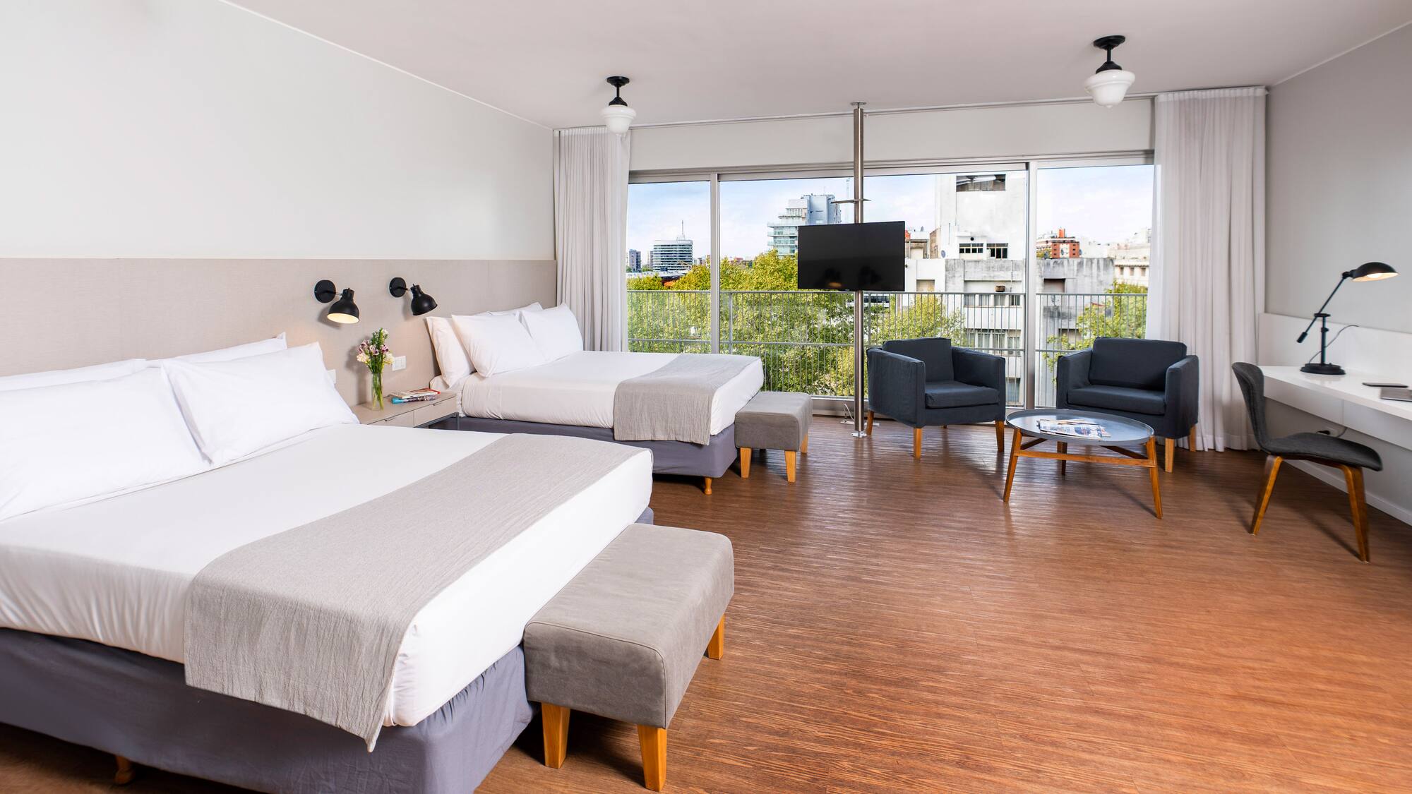 a room with two beds and a couch