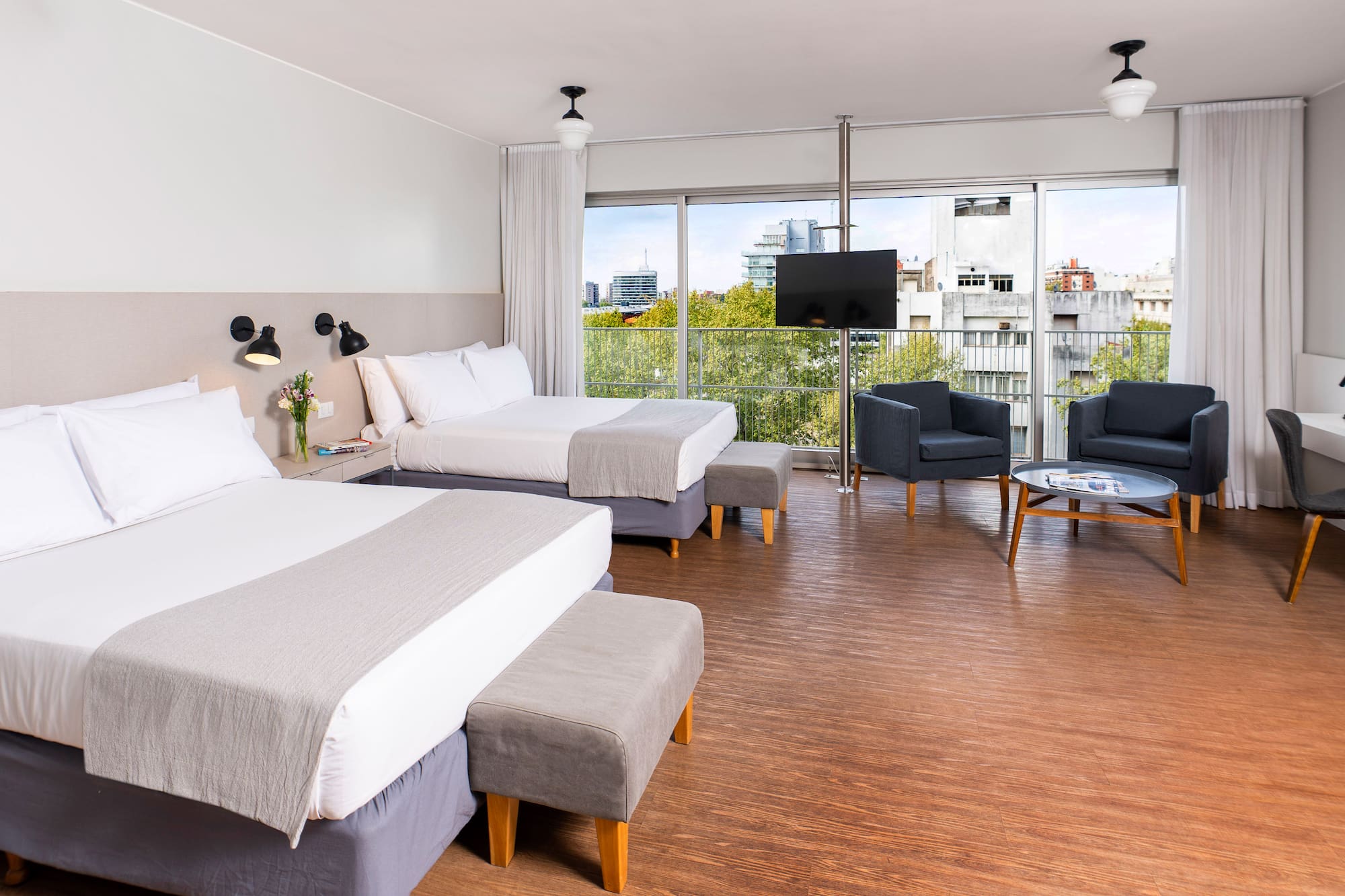 a room with two beds and a couch