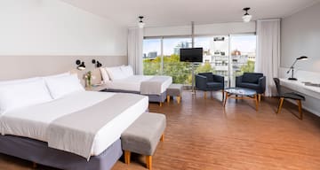 a room with two beds and a couch