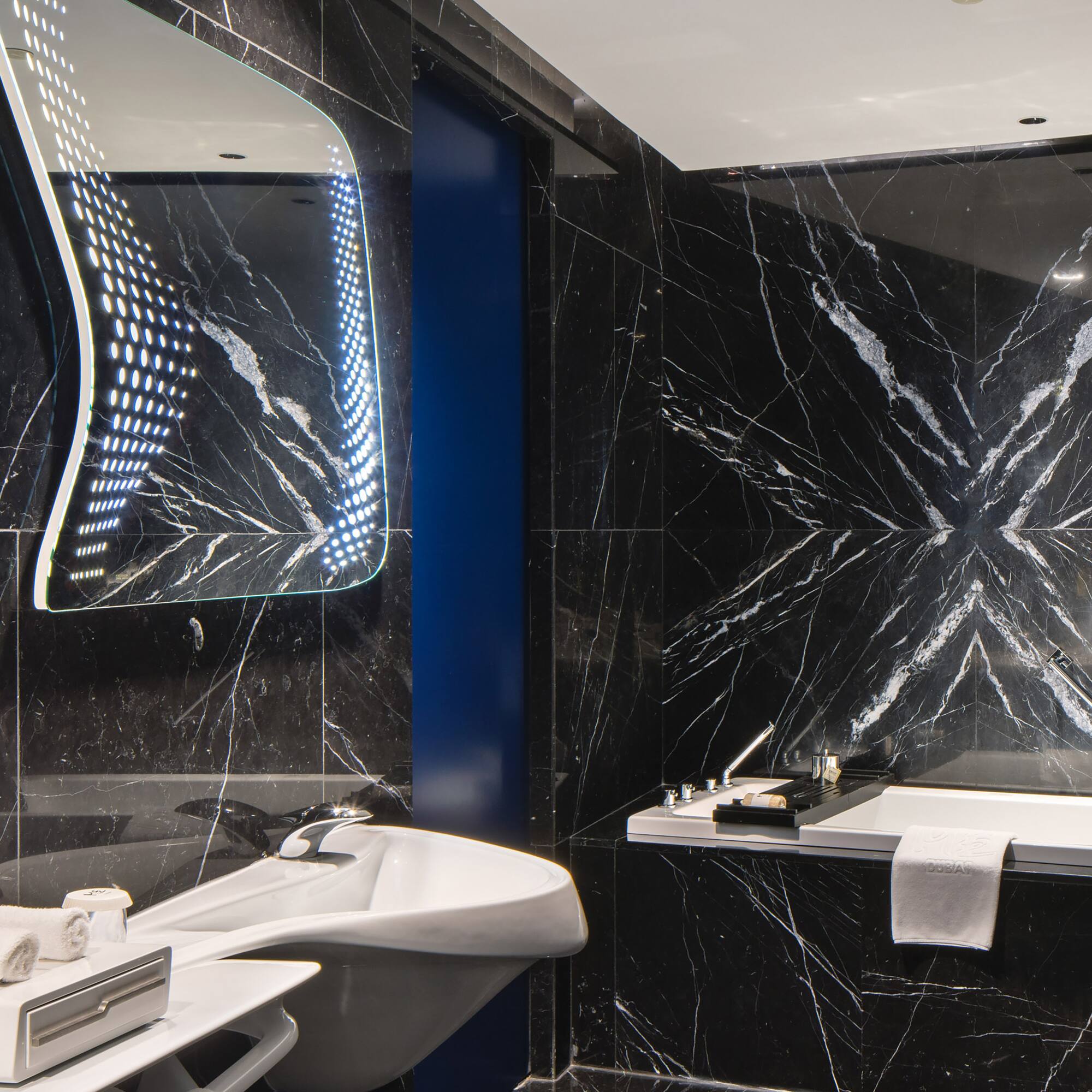 a bathroom with a bathtub and sink