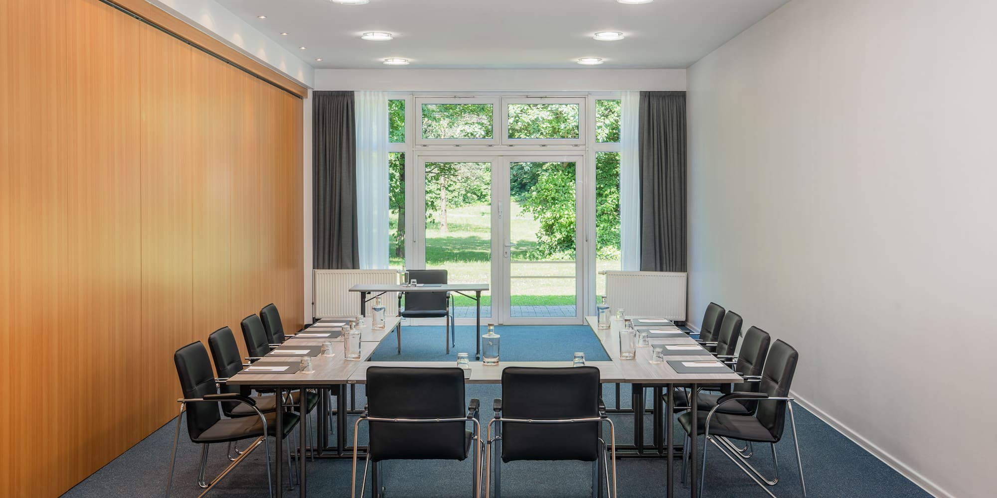a conference room with a table and chairs