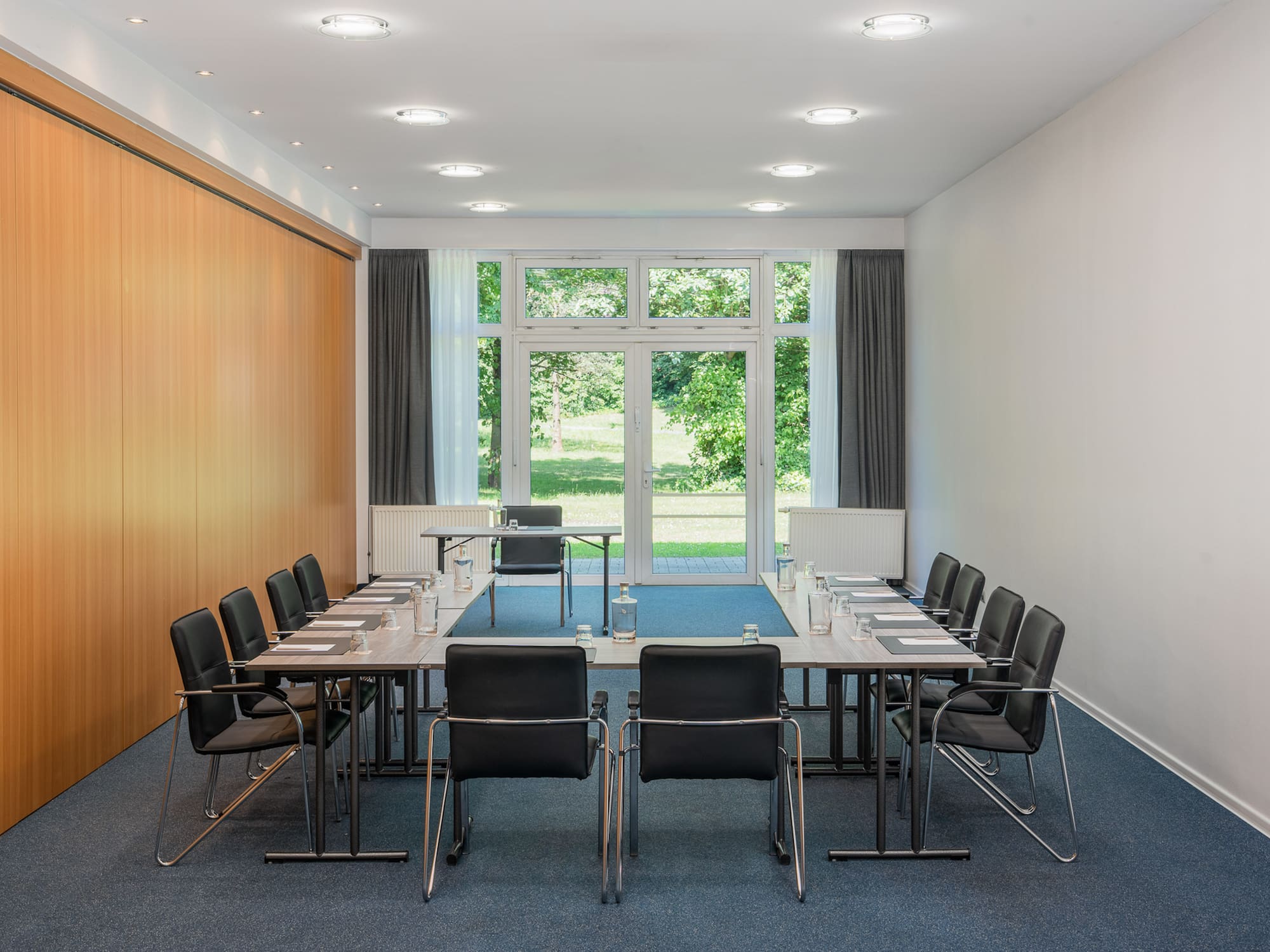 a conference room with a table and chairs
