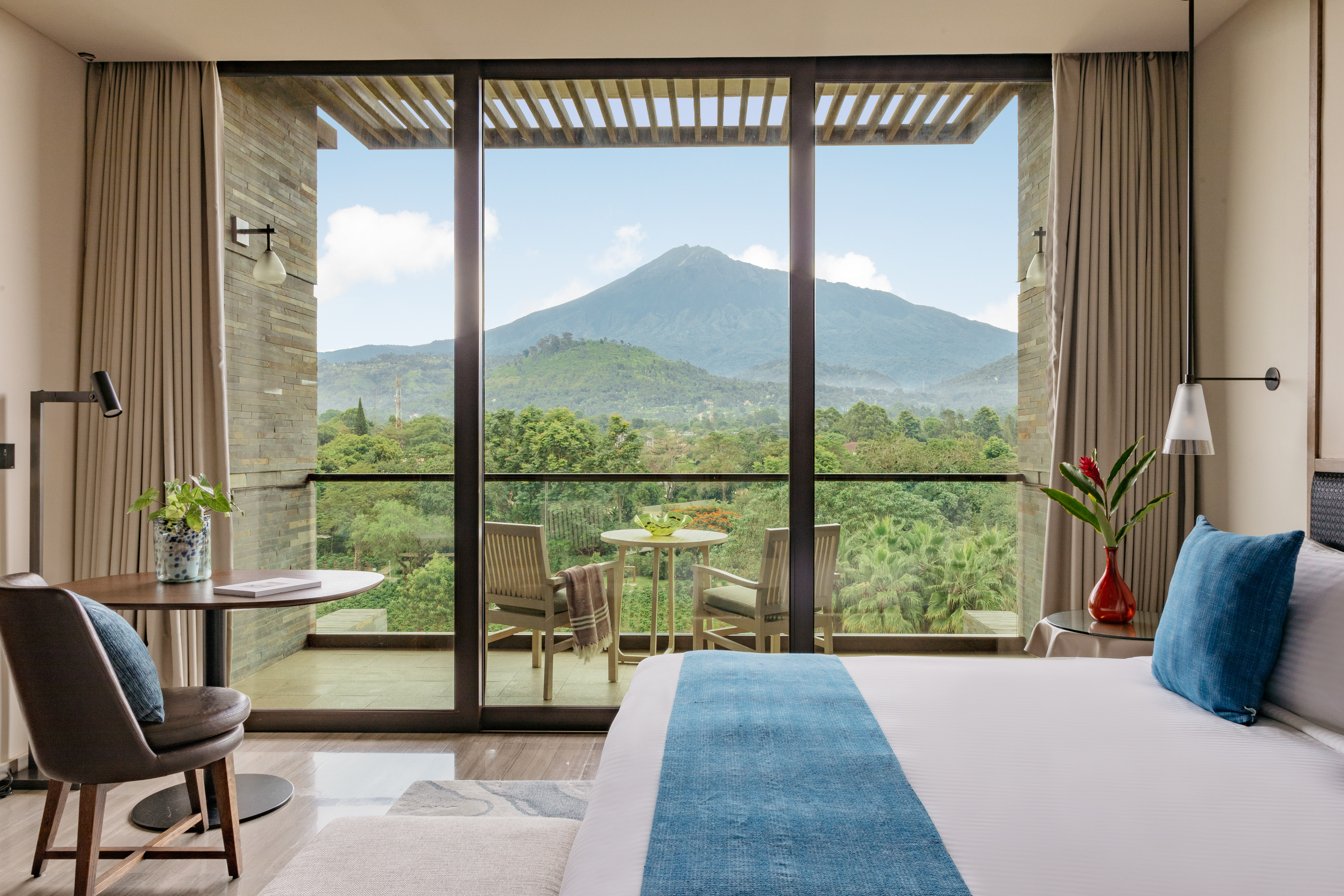 a room with a view of a mountain and trees