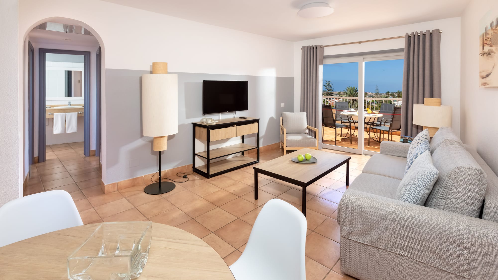 a living room with a television and a table