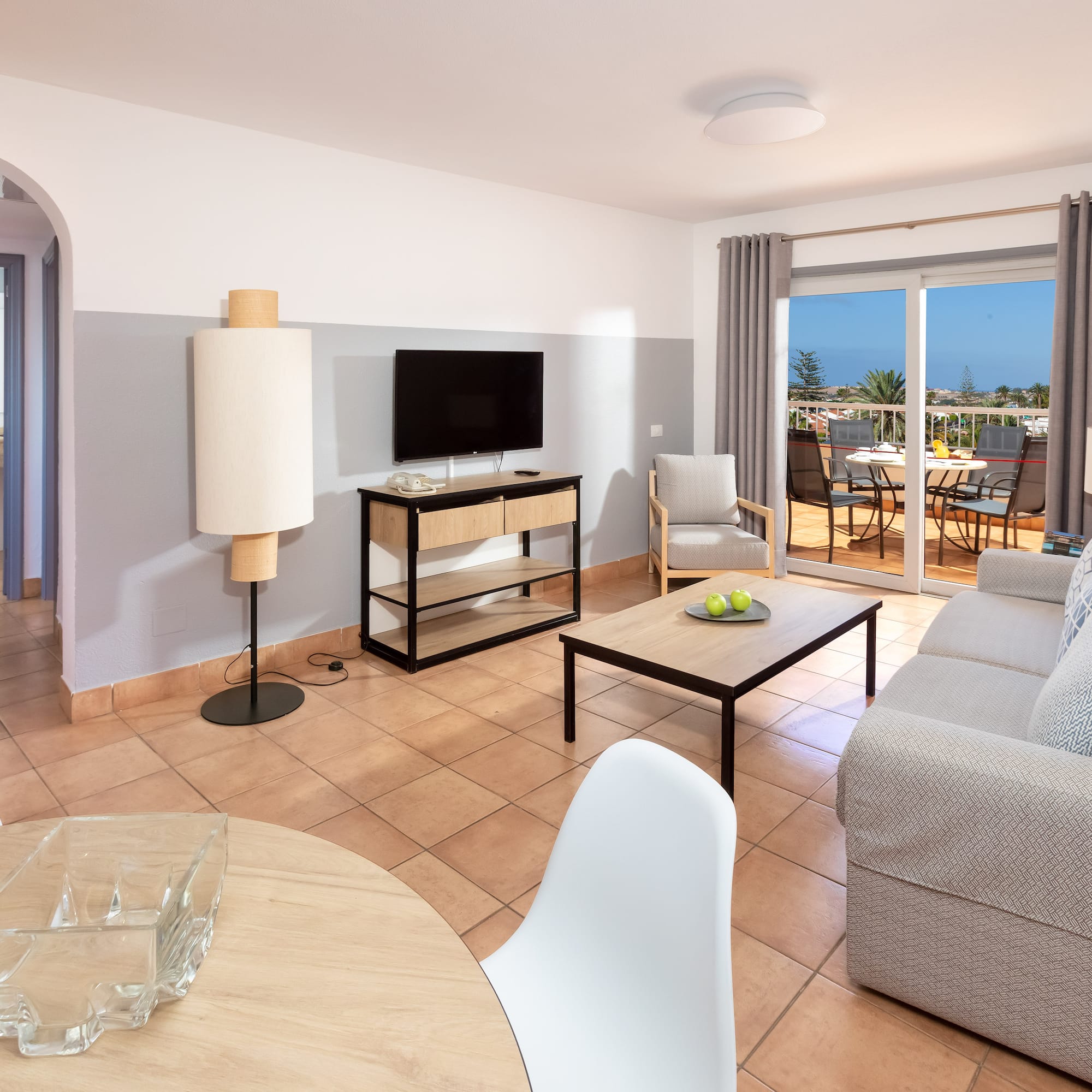 a living room with a television and a table