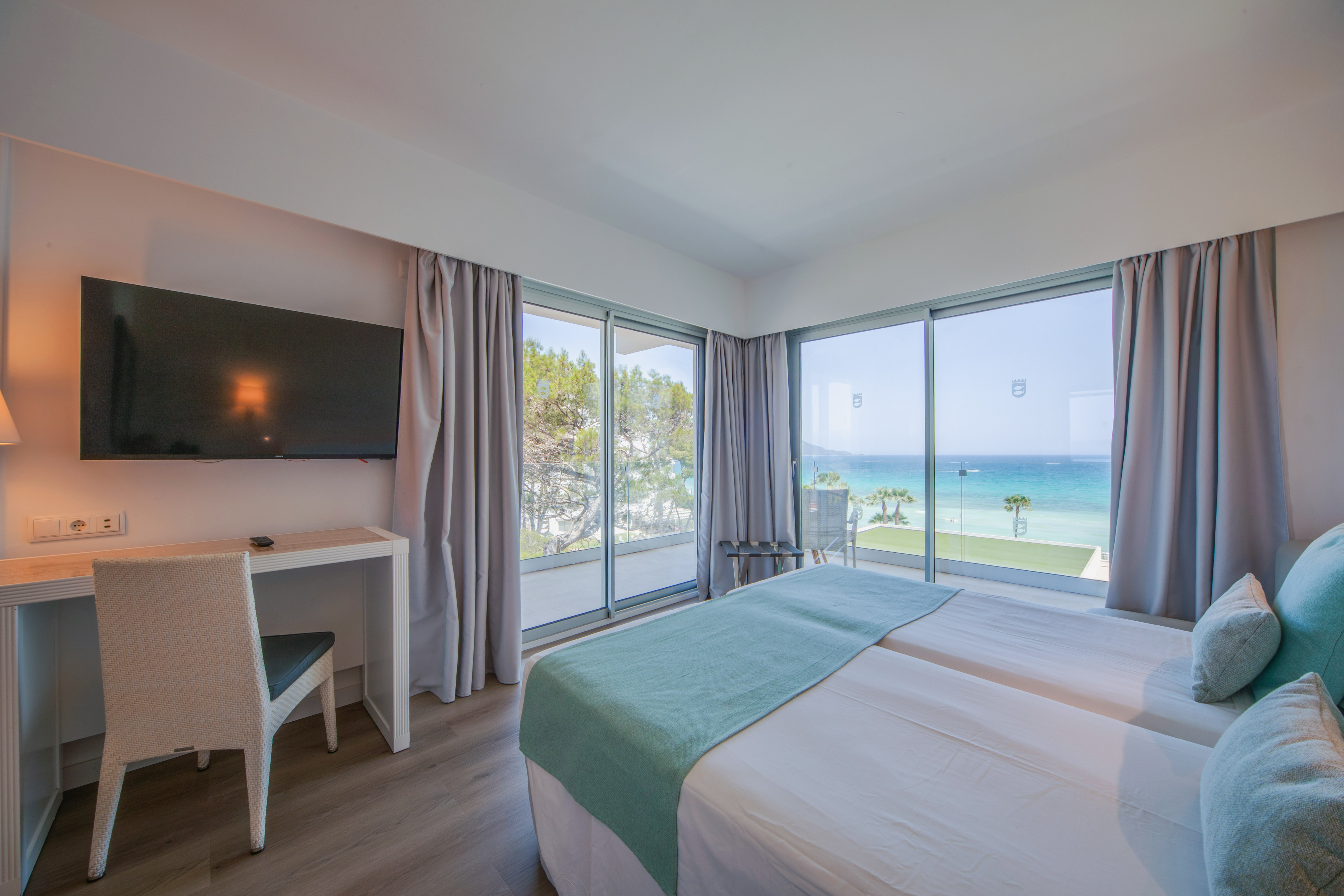 a room with a television and a bed