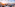 Rooftop igloo lounge with cozy seating, sunset city views, and festive decor.