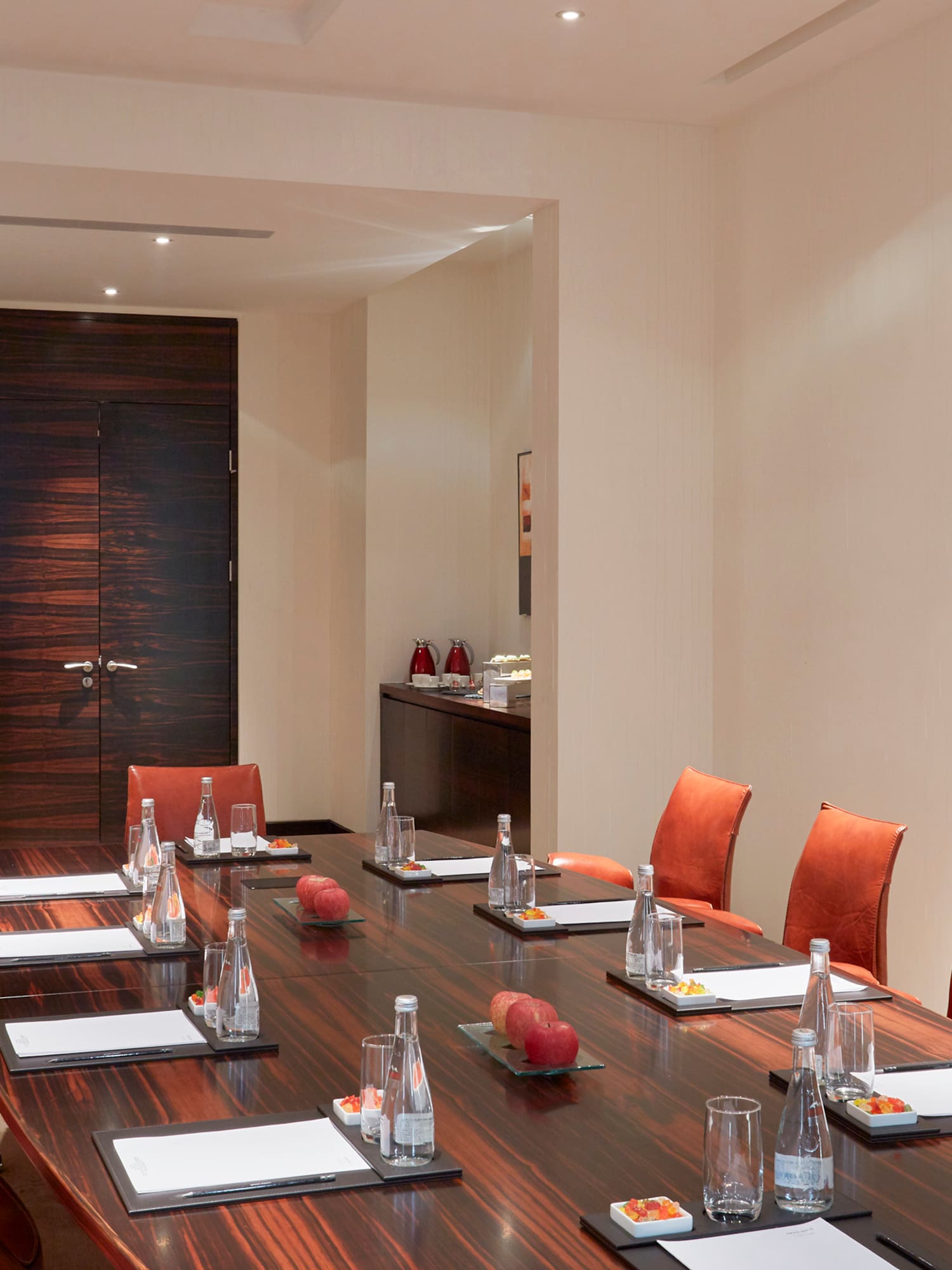 a conference room with a table and chairs