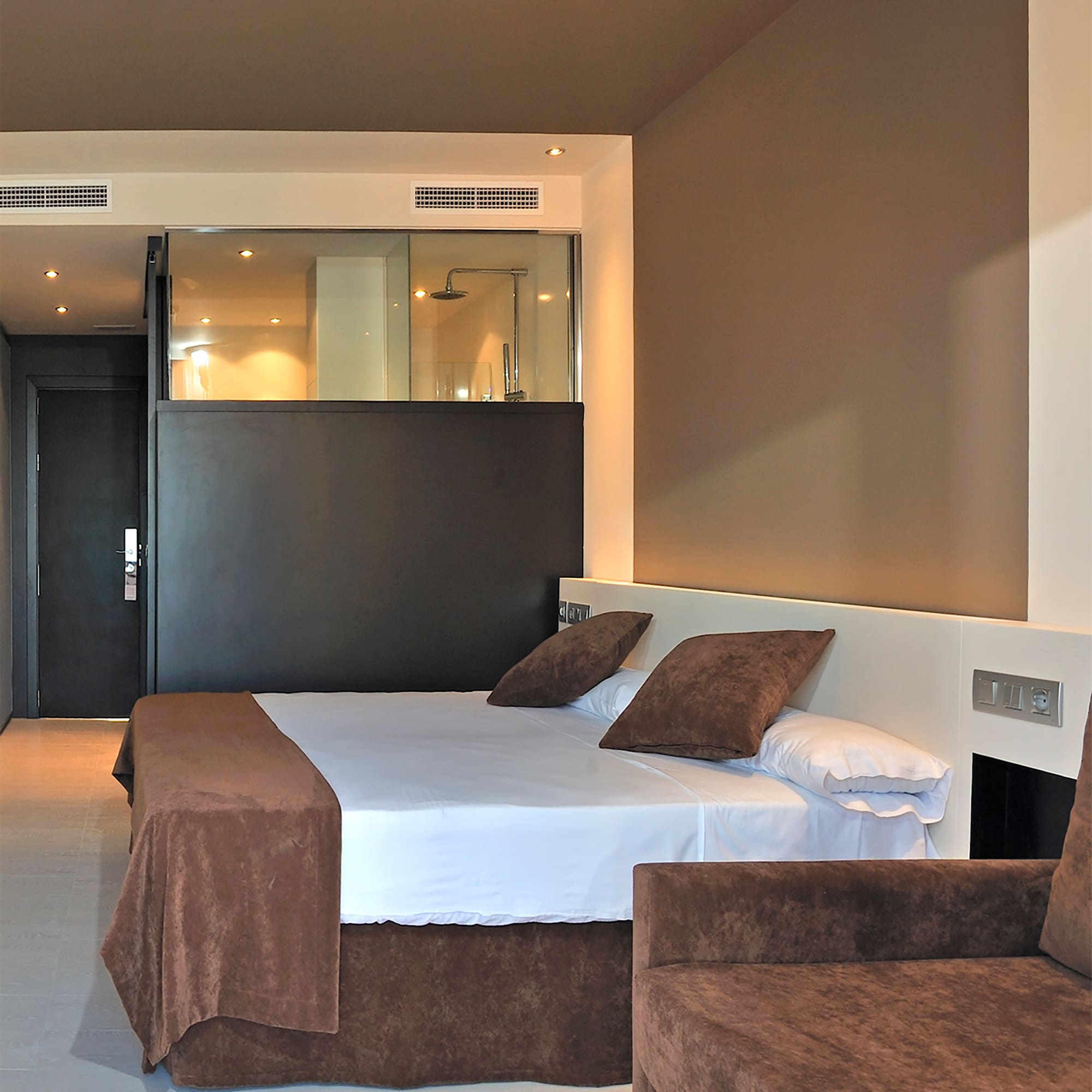 a bed and couch in a room