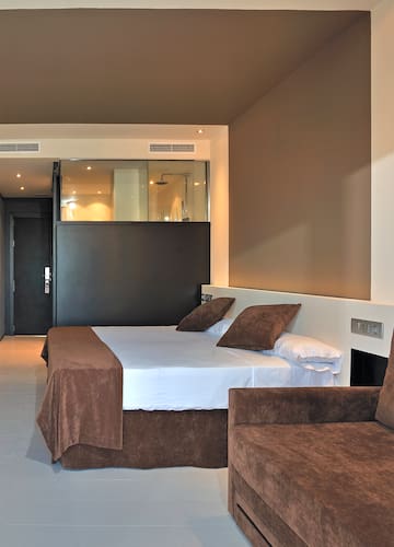 a bed and couch in a room