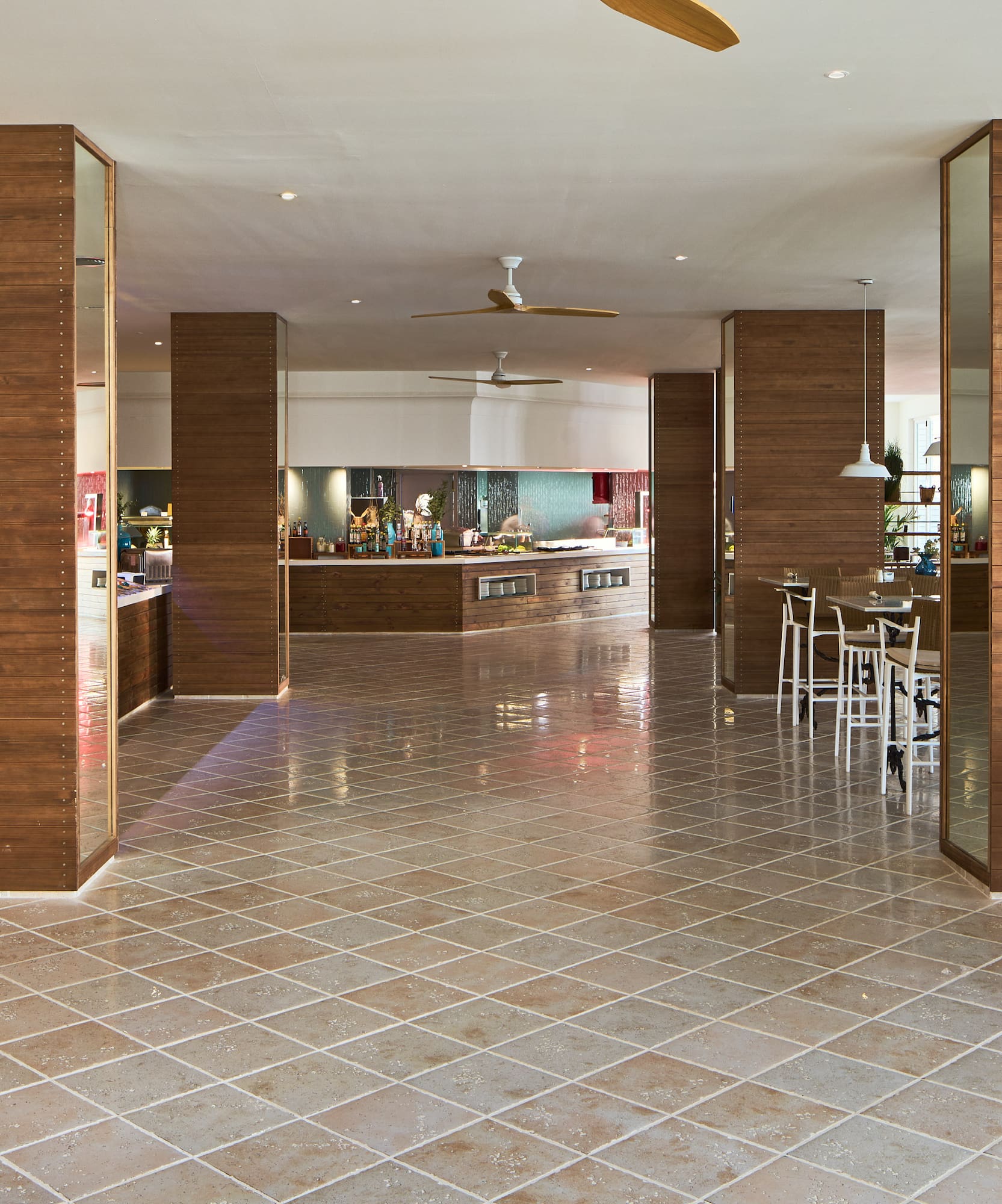 a room with wood walls and a tile floor