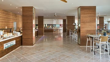 a room with wood walls and a tile floor