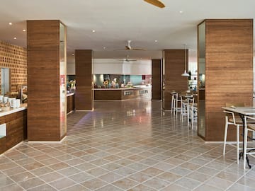 a room with wood walls and a tile floor