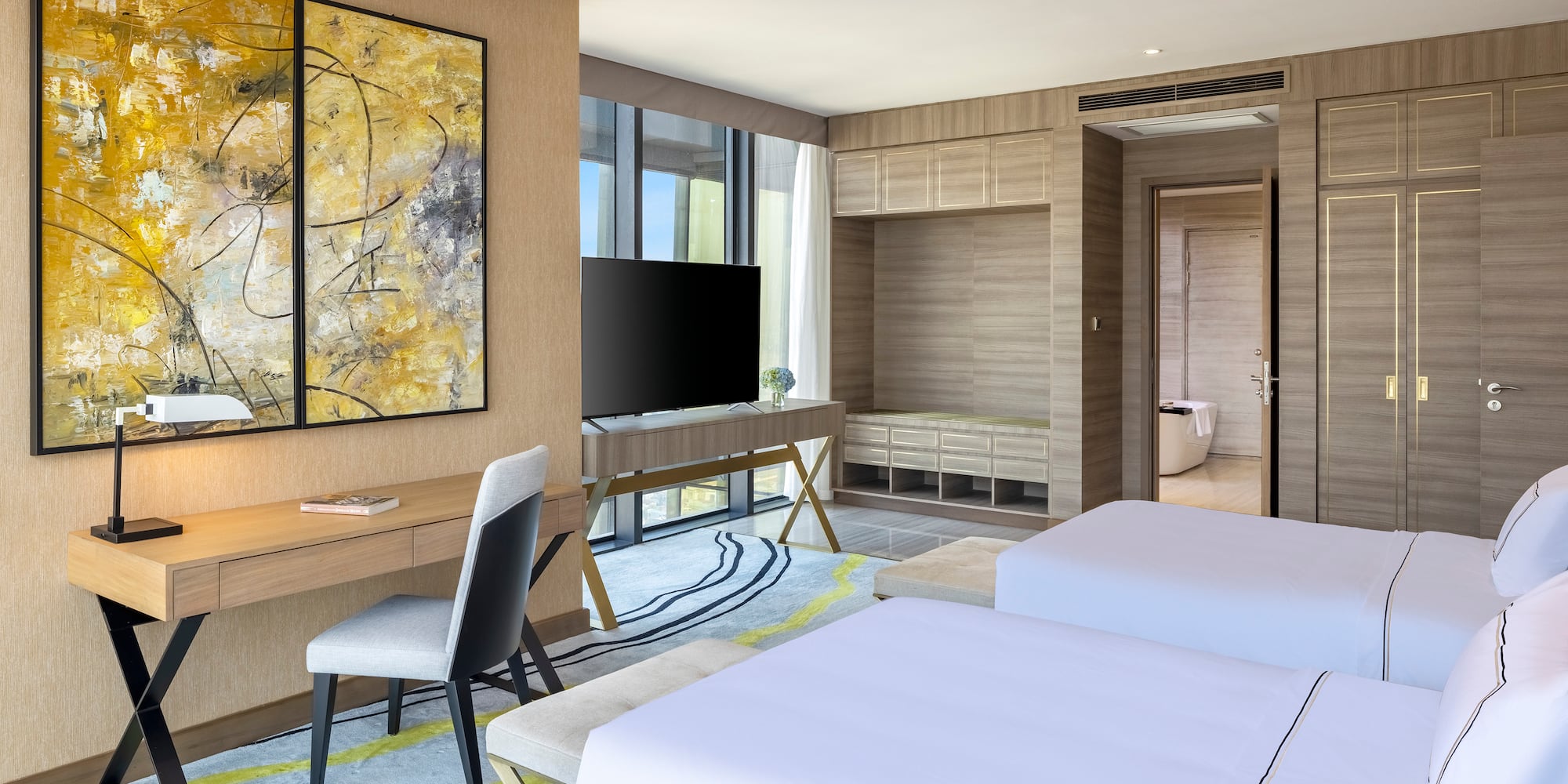 a room with two beds and a tv