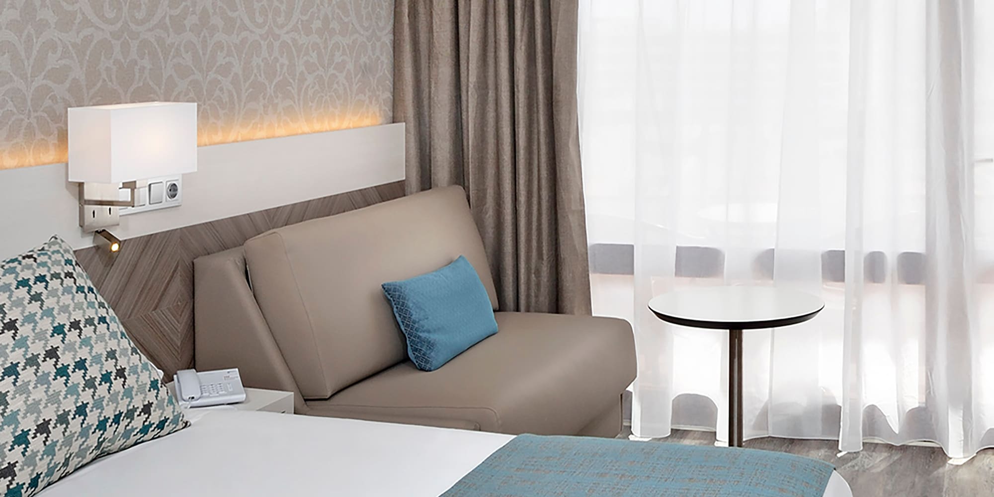 a bed and a couch in a hotel room