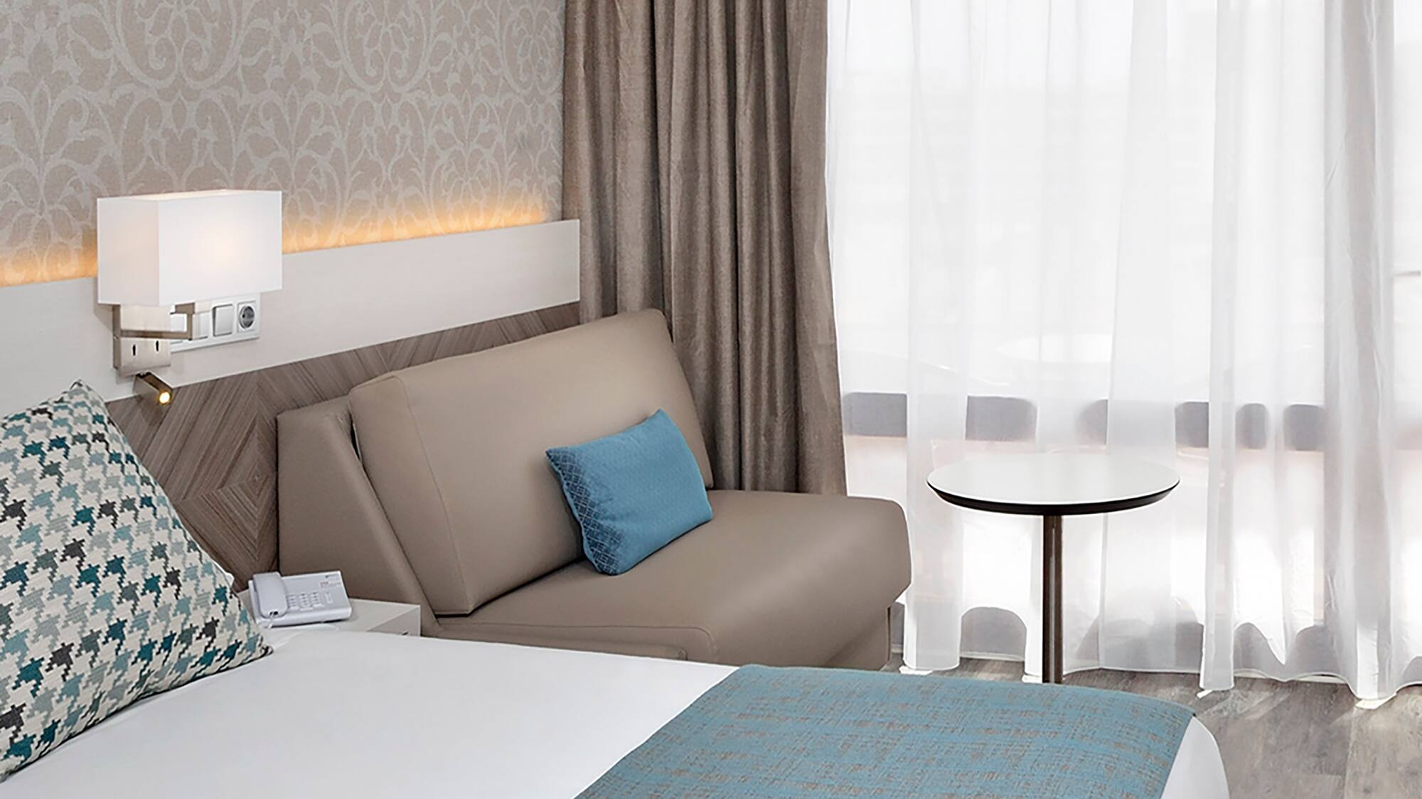 a bed and a couch in a hotel room