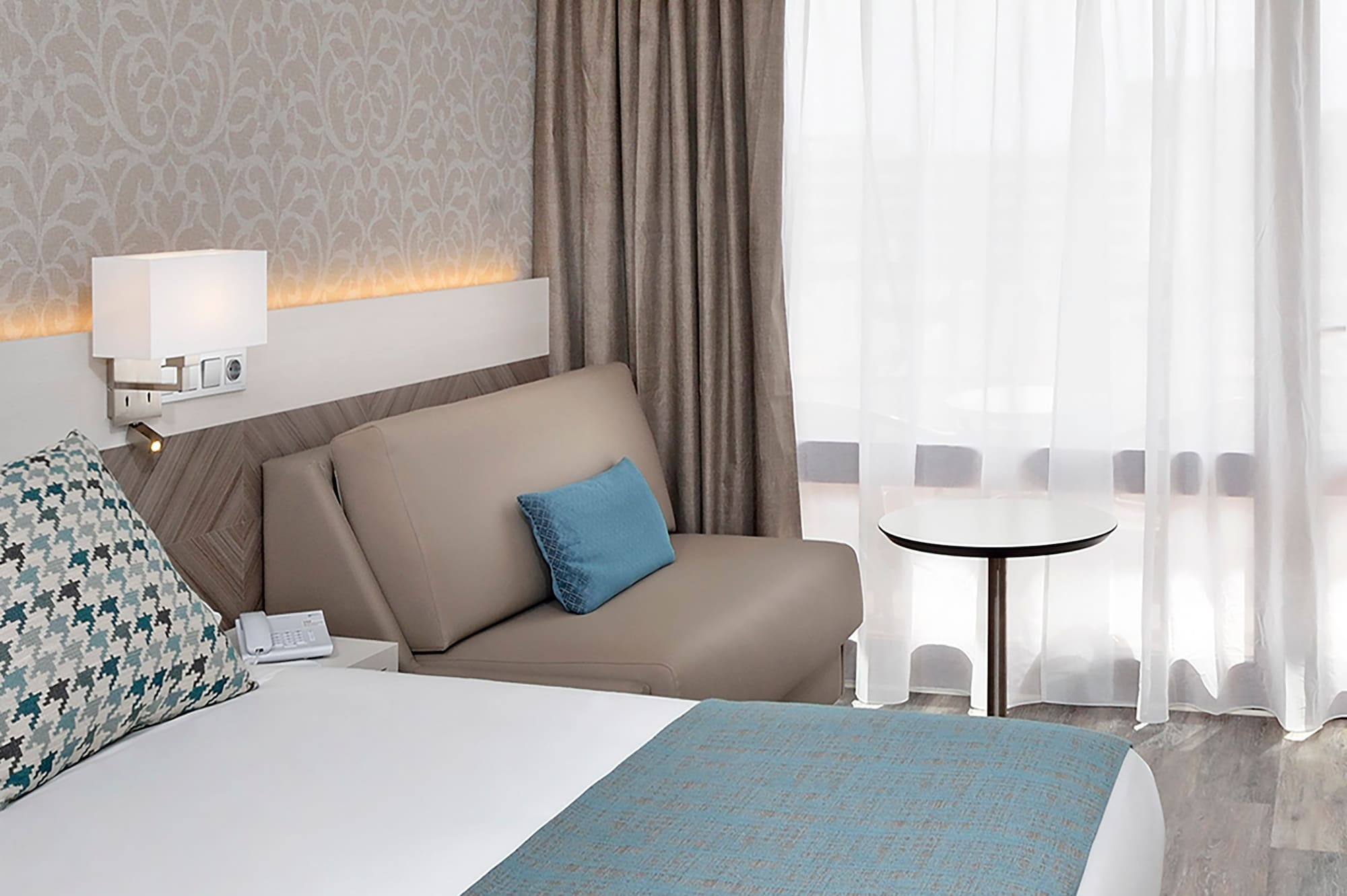 a bed and a couch in a hotel room