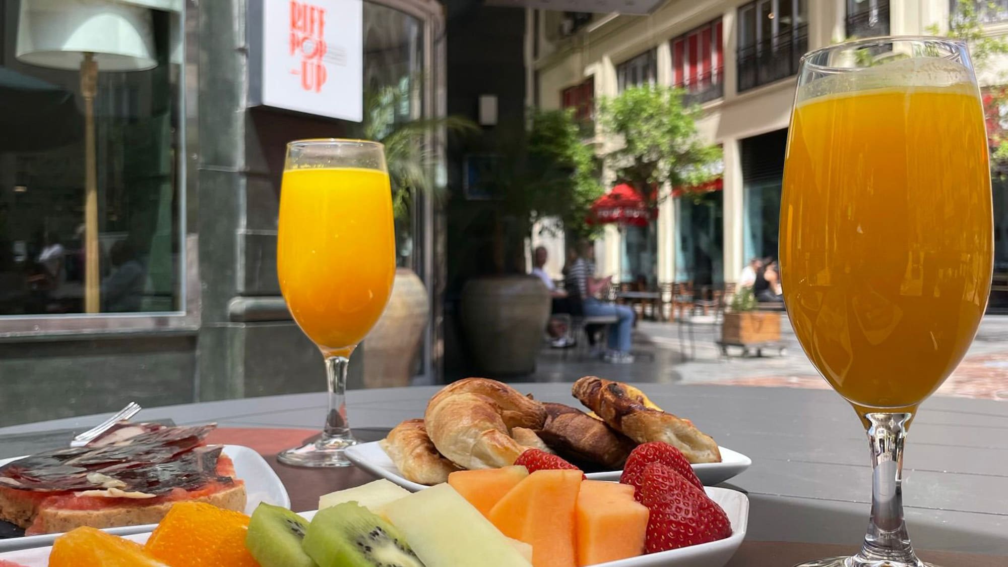 a plate of food and a drink on a table