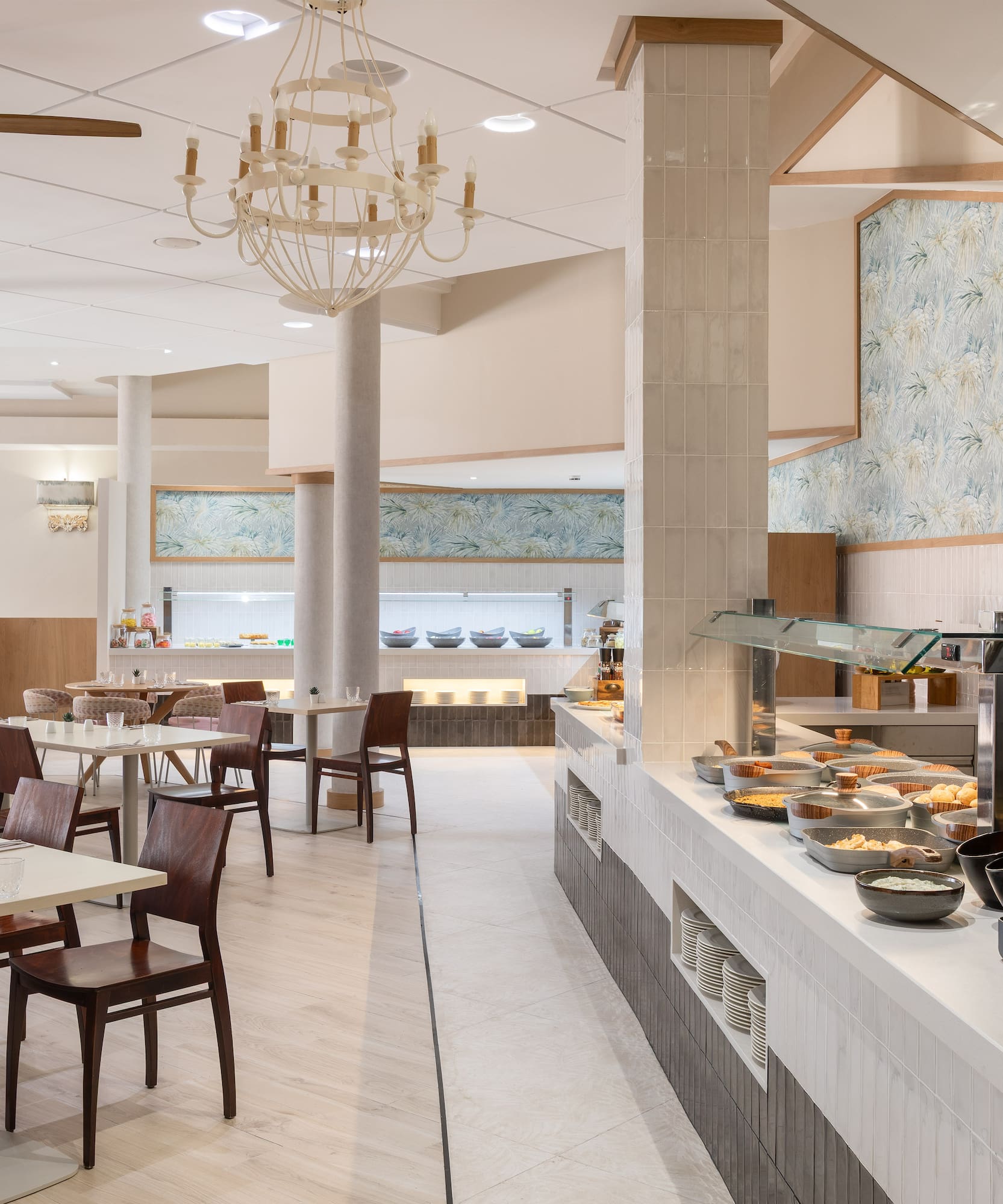 Spacious modern hotel restaurant buffet and dining area.