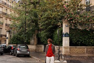 a man walking across a street