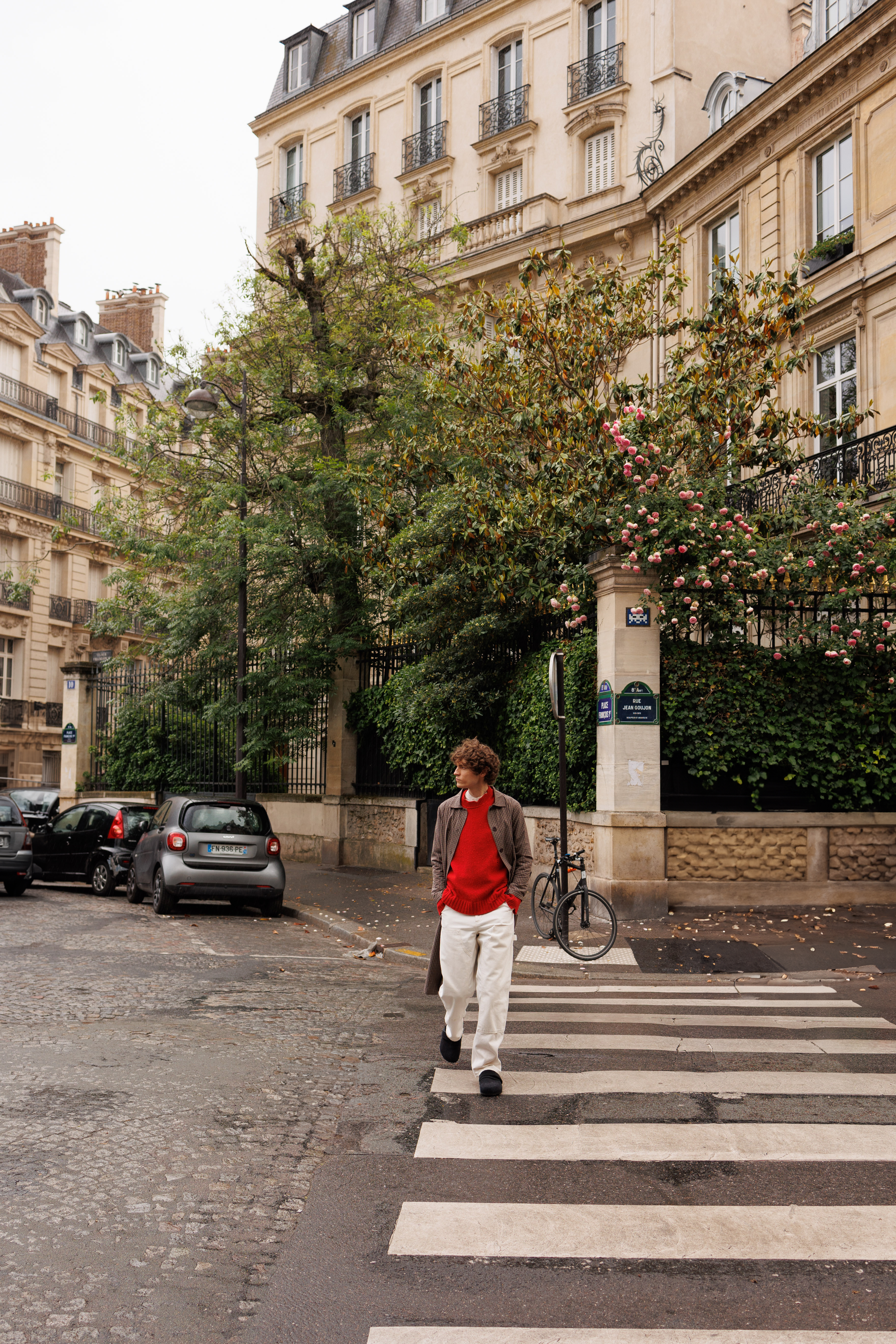 a man walking across a street