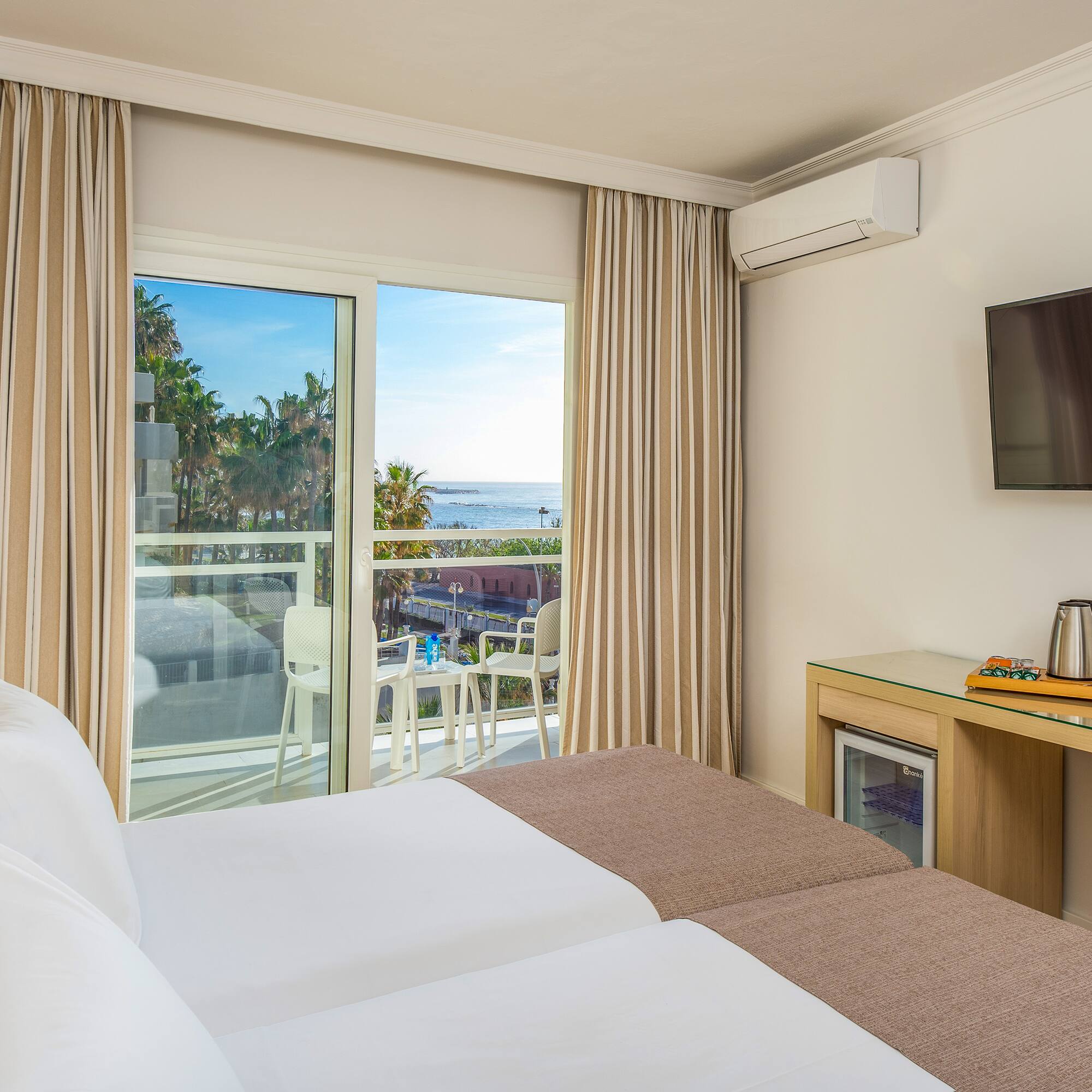 a room with a television and a bed